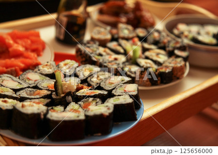 table with a set of rolls and sauce table with a set of rolls and sauce 125656000