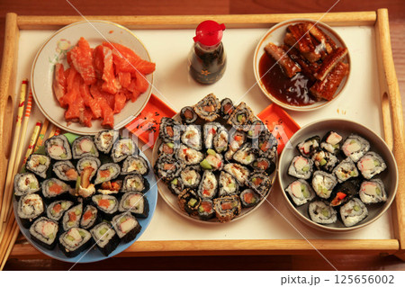 table with a set of rolls and sauce 125656002