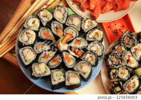 table with a set of rolls and sauce table with a set of rolls and sauce 125656003