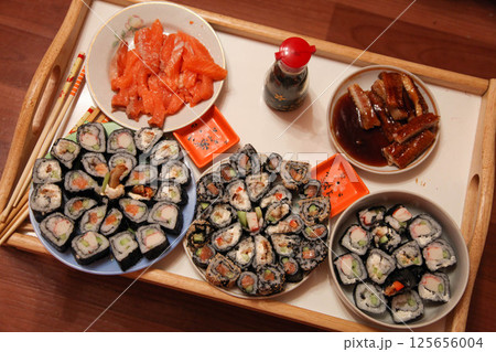 table with a set of rolls and sauce table with a set of rolls and sauce 125656004