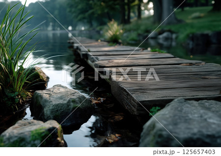Wooden walkway in the park with foggy background, soft focus 125657403