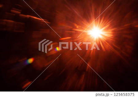 Sun flare on the black background 125658375