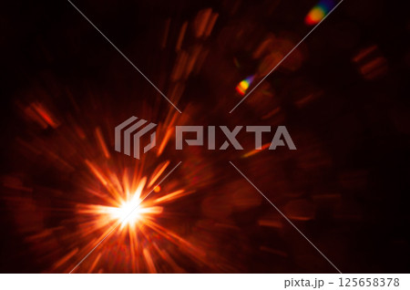 Sun flare on the black background Sun flare on the black background 125658378