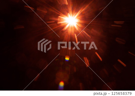 Sun flare on the black background 125658379