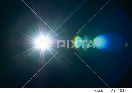 Sun flare on the black background 125658389