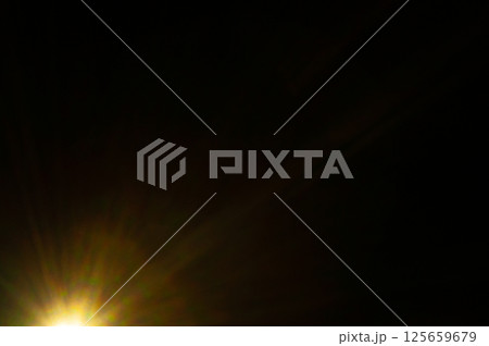 Sun flare on the black background 125659679