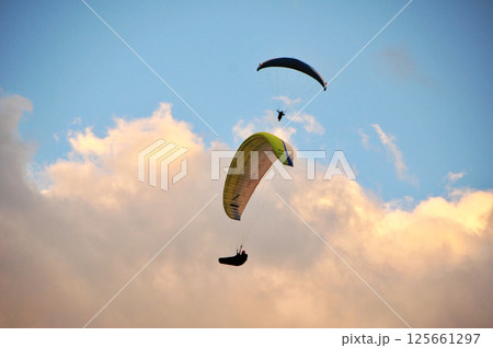 Two paragliders in the sky 125661297