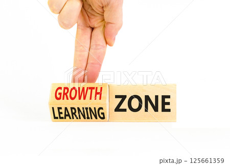 Learning or growth zone symbol. Concept words Learning zone Growth zone on wooden cubes. Beautiful white table white background. Psychologist hand. Business learning or growth zone concept. Copy space Learning or growth zone symbol. Concept words Learning zone Growth zone on wooden cubes. Beautiful white table white background. Psychologist hand. Business learning or growth zone concept. Copy space 125661359