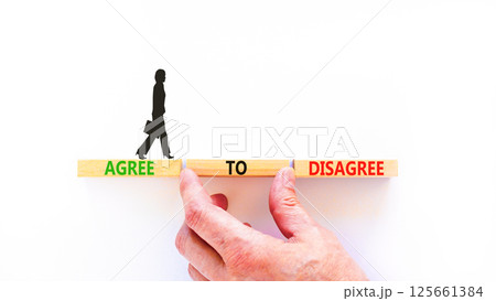 Agree to disagree symbol. Concept words Agree to disagree on beautiful wooden block. Businesswoman's icon. Beautiful white background. Business and agree to disagree concept. Copy space. Agree to disagree symbol. Concept words Agree to disagree on beautiful wooden block. Businesswoman's icon. Beautiful white background. Business and agree to disagree concept. Copy space. 125661384