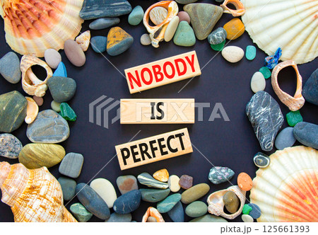 Nobody is perfect symbol. Concept words Nobody is perfect on beautiful block. Sea stones shells. Beautiful black background. Business motivational lifestyle and nobody is perfect concept. Copy space. Nobody is perfect symbol. Concept words Nobody is perfect on beautiful block. Sea stones shells. Beautiful black background. Business motivational lifestyle and nobody is perfect concept. Copy space. 125661393
