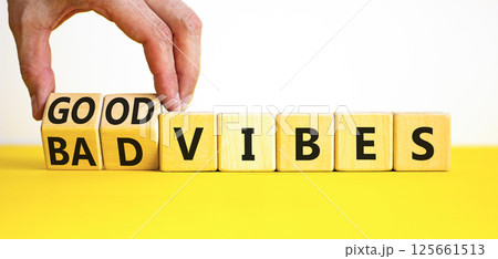 Good or bad vibes symbol. Concept words Good vibes Bad vibes on beautiful wooden blocks. Beautiful yellow table white background. Businessman hand. Business good or bad vibes concept. Copy space 125661513