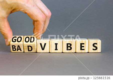 Good or bad vibes symbol. Concept words Good vibes Bad vibes on beautiful wooden blocks. Beautiful grey table grey background. Businessman hand. Business good or bad vibes concept. Copy space 125661516
