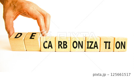 Decarbonization or carbonization symbol. Concept words Decarbonization or Carbonization on wooden blocks. Beautiful white background. Business decarbonization or carbonization concept. Copy space. Decarbonization or carbonization symbol. Concept words Decarbonization or Carbonization on wooden blocks. Beautiful white background. Business decarbonization or carbonization concept. Copy space. 125661517