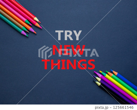 Try new things symbol. Concept words Try new things on beautiful black paper. Colored pencils. Beautiful black background. Business motivational lifestyle try new things concept. Copy space. Try new things symbol. Concept words Try new things on beautiful black paper. Colored pencils. Beautiful black background. Business motivational lifestyle try new things concept. Copy space. 125661546