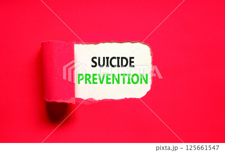 Suicide prevention symbol. Concept words Suicide prevention on beautiful white paper. Beautiful red table red background. Psychological suicide prevention concept. Copy space Suicide prevention symbol. Concept words Suicide prevention on beautiful white paper. Beautiful red table red background. Psychological suicide prevention concept. Copy space 125661547