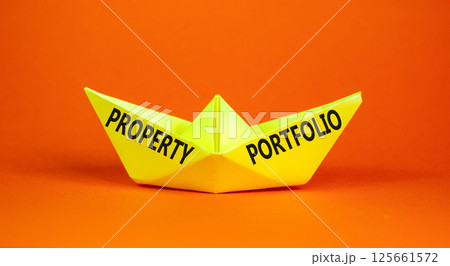 Property portfolio symbol. Concept words Property portfolio on beautiful yellow paper boat. Beautiful orange paper background. Business Property portfolio concept. Copy space. Property portfolio symbol. Concept words Property portfolio on beautiful yellow paper boat. Beautiful orange paper background. Business Property portfolio concept. Copy space. 125661572