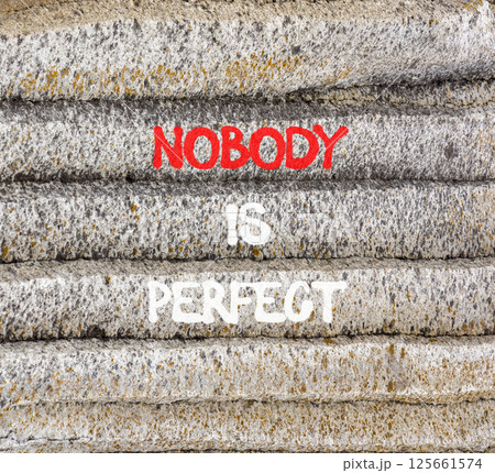 Nobody is perfect symbol. Concept words Nobody is perfect on beautiful grey stone. Beautiful grey mountain stone background. Business motivational lifestyle and nobody is perfect concept. Copy space. Nobody is perfect symbol. Concept words Nobody is perfect on beautiful grey stone. Beautiful grey mountain stone background. Business motivational lifestyle and nobody is perfect concept. Copy space. 125661574
