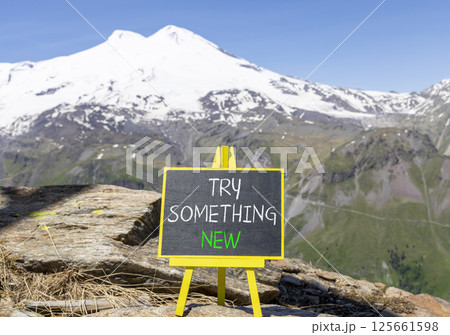 Try something new symbol. Concept words Try something new on beautiful blackboard. Beautiful mountain Elbrus background. Business motivational lifestyle try something new concept. Copy space. Try something new symbol. Concept words Try something new on beautiful blackboard. Beautiful mountain Elbrus background. Business motivational lifestyle try something new concept. Copy space. 125661598