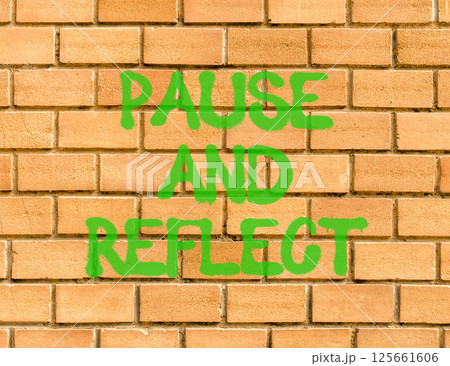 Pause and reflect symbol. Concept words Pause and reflect on beautiful brick wall . Beautiful brick wall background. Business motivational lifestyle pause and reflect concept. Copy space. 125661606