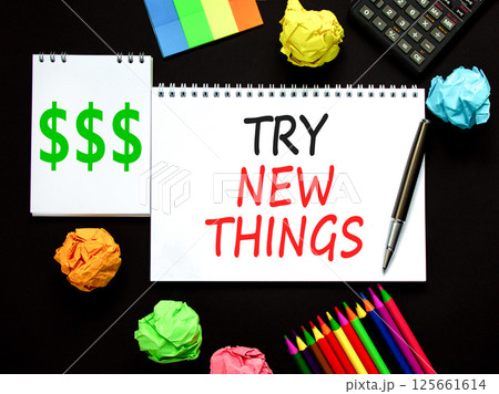 Try new things symbol. Concept words Try new things on beautiful white note. Black pen. Calculator. Beautiful black background. Business motivational lifestyle try new things concept. Copy space. 125661614