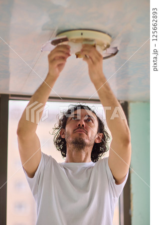 Efficiently Replacing the Ceiling Light Fixture in Your Home for Better Illumination and Comfort Efficiently Replacing the Ceiling Light Fixture in Your Home for Better Illumination and Comfort 125662893