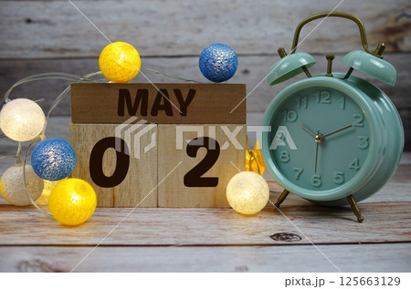 Wooden Calendar Showing the Date of May 2nd. Day 2 of May month Wooden Calendar Showing the Date of May 2nd. Day 2 of May month 125663129