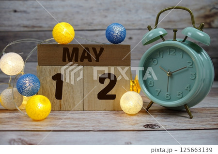 Wooden Calendar Showing the Date of May 12th. Day 12 of May month 125663139