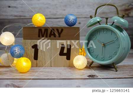 Wooden Calendar Showing the Date of May 14th. Day 14 of May month 125663141