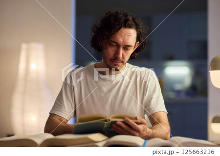 A Delightful and Charming Evening Reading Mood Enhanced with Soft, Ambient Lighting 125663216