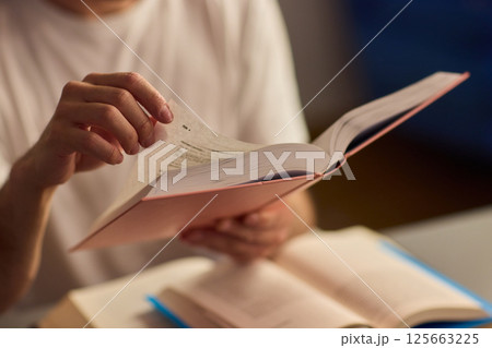 A Delightful and Charming Evening Reading Mood Enhanced with Soft, Ambient Lighting 125663225