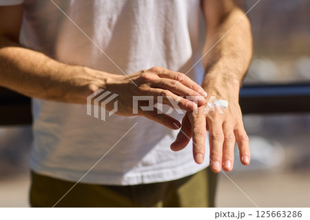 Applying Skincare Cream Daily on Hands for Achieving Healthy, Hydrated, and Radiant Skin Care 125663286