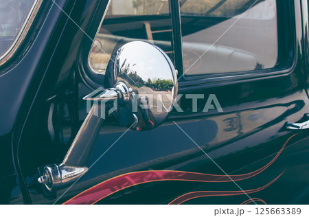 close up of classic vintage car side with rear view mirror. side mirror of a vintage car, 125663389