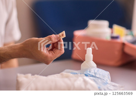 Healthcare Preparations Hand Holding Essential Medical Supplies for Effective Care Healthcare Preparations Hand Holding Essential Medical Supplies for Effective Care 125663569