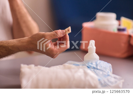 Healthcare Preparations Hand Holding Essential Medical Supplies for Effective Care 125663570