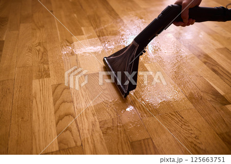 The comprehensive Wood Floor Cleaning Process utilizing a Wet Vacuum for optimal results The comprehensive Wood Floor Cleaning Process utilizing a Wet Vacuum for optimal results 125663751