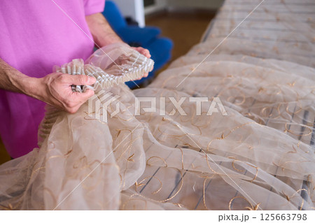 A Beautiful and Delicate Fabric Display Positioned on a Drying Rack for All to See 125663798