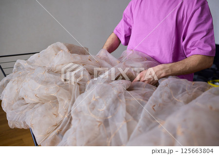 A Beautiful and Delicate Fabric Display Positioned on a Drying Rack for All to See 125663804