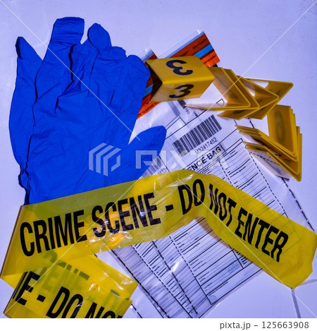 Forensic Scene Tape, Gloves, and Evidence Bag 125663908