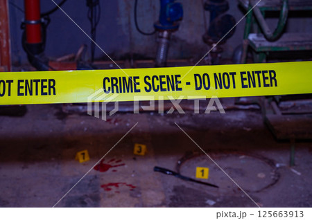 Forensic Crime Scene Investigation with Bloodstains and Numbered Markers 125663913
