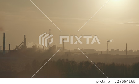 The Industrial Landscape Beautifully Captured Under a Hazy Sky at Dusk Time of Day The Industrial Landscape Beautifully Captured Under a Hazy Sky at Dusk Time of Day 125664169