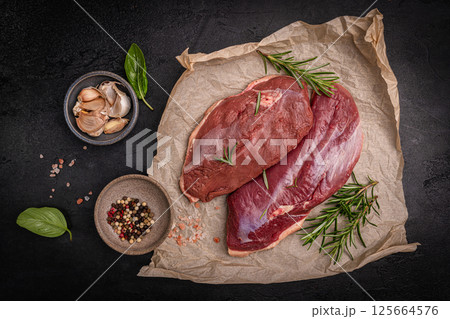 Preparation for cooking raw duck breast 125664576