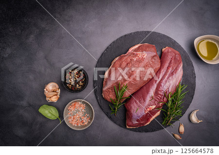 Preparation for cooking raw duck breast 125664578