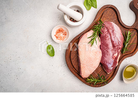 Preparation for cooking raw duck breast Preparation for cooking raw duck breast 125664585