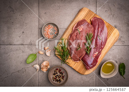Preparation for cooking raw duck breast 125664587