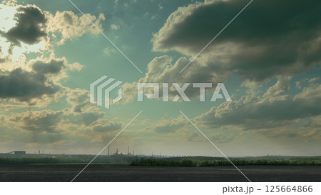 A Dramatic and Striking Sky Over an Expansive Industrial Landscape Captivates the Eye A Dramatic and Striking Sky Over an Expansive Industrial Landscape Captivates the Eye 125664866