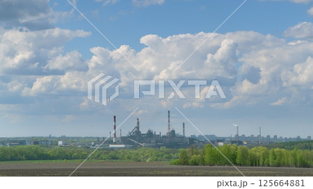 The Industrial Landscape is Set Against a Dramatic and Striking Sky That Captivates Attention The Industrial Landscape is Set Against a Dramatic and Striking Sky That Captivates Attention 125664881