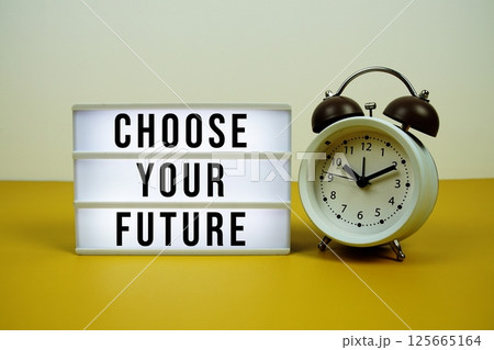 Critical Success Factors text on light box with alarm clock on yellow background 125665164