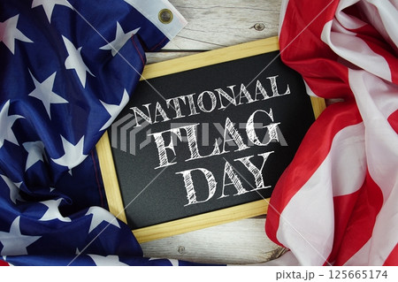 National Flag Day text message with USA flag on wooden background, America national holiday concept 125665174