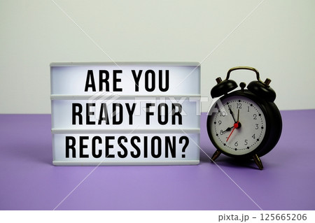 Are you ready for recession? text on light box with alarm clock on purple background 125665206