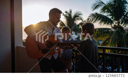 Father playing guitar and singing on the porch during sunset, soft backlight. Generated image 125665772